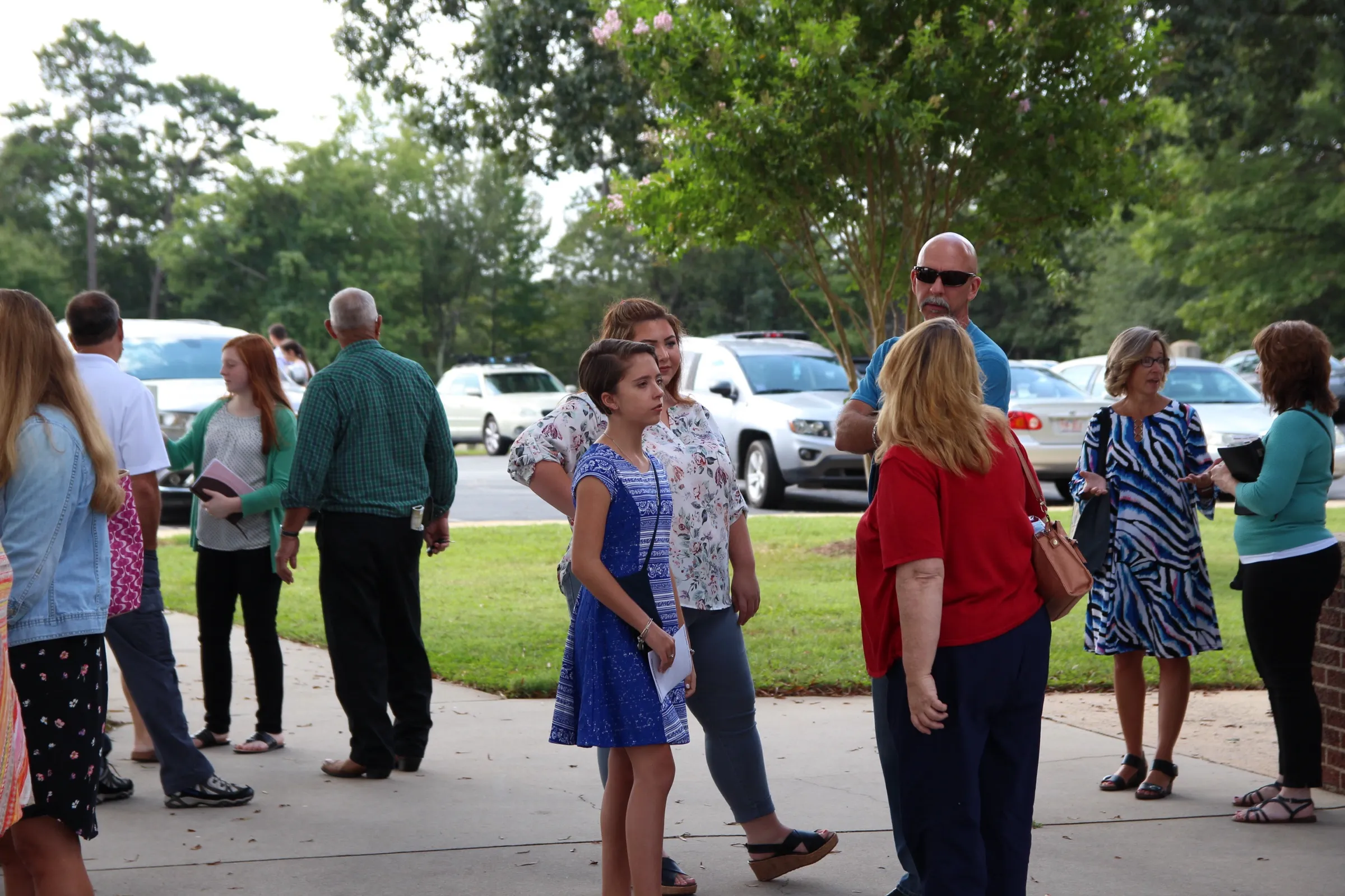 Families talking outside the church on a Sunday morning